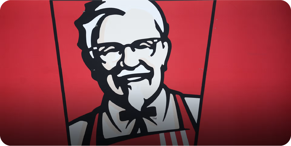 A black and white illustrative logo of KFC's Colonel Sanders on a red background, a classic example of a mascot driving brand recognition.
